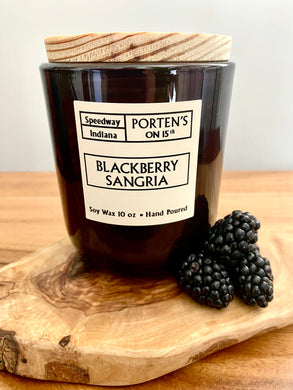 Blackberry Sangria 10 oz soy candle in a black jar with wooden lid.  