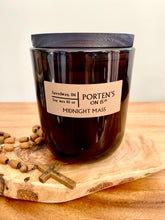 Load image into Gallery viewer, Midnight Mass soy candle. 10 oz in a black tumbler jar. With hints of Incense - Smoke - Frankincense - Myrrh - Amber - Musk - Leather - Oud