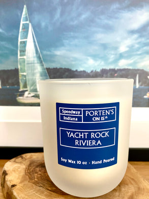 Yacht Rock Riviera 10 oz soy candle.  Comes in muted clear jar with royal blue label.  