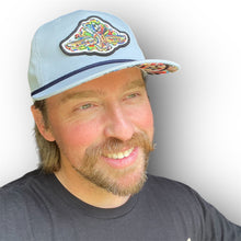 Load image into Gallery viewer, Indianapolis Motor Speedway Wing and Wheel Rope Hat by Justin Patten (Light Blue)