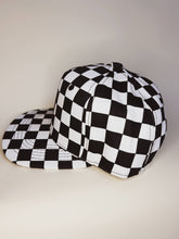 Load image into Gallery viewer, Side view of checkered kids Indy hat. 

