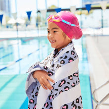 Load image into Gallery viewer, Little swimmer with the Lively Leopard Quick Dry Towel around her shoulders. 
