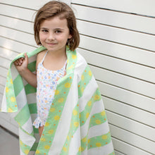 Load image into Gallery viewer, Little girl with Quick Dry Kids Towel in the color Fun in the Sun around her shoulders. 
