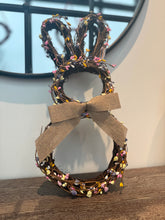 Load image into Gallery viewer, Adorable Easter bunny: Rustic twig base with lavender, pink, yellow, and white pip berries. Burlap bow tie. 16&quot;x8&quot; decoration.
