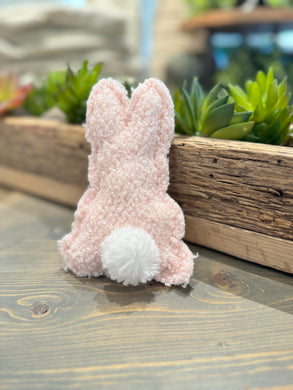 Pink stuffed bunny with soft sherpa fabric and white pom-pom tail. (3.5