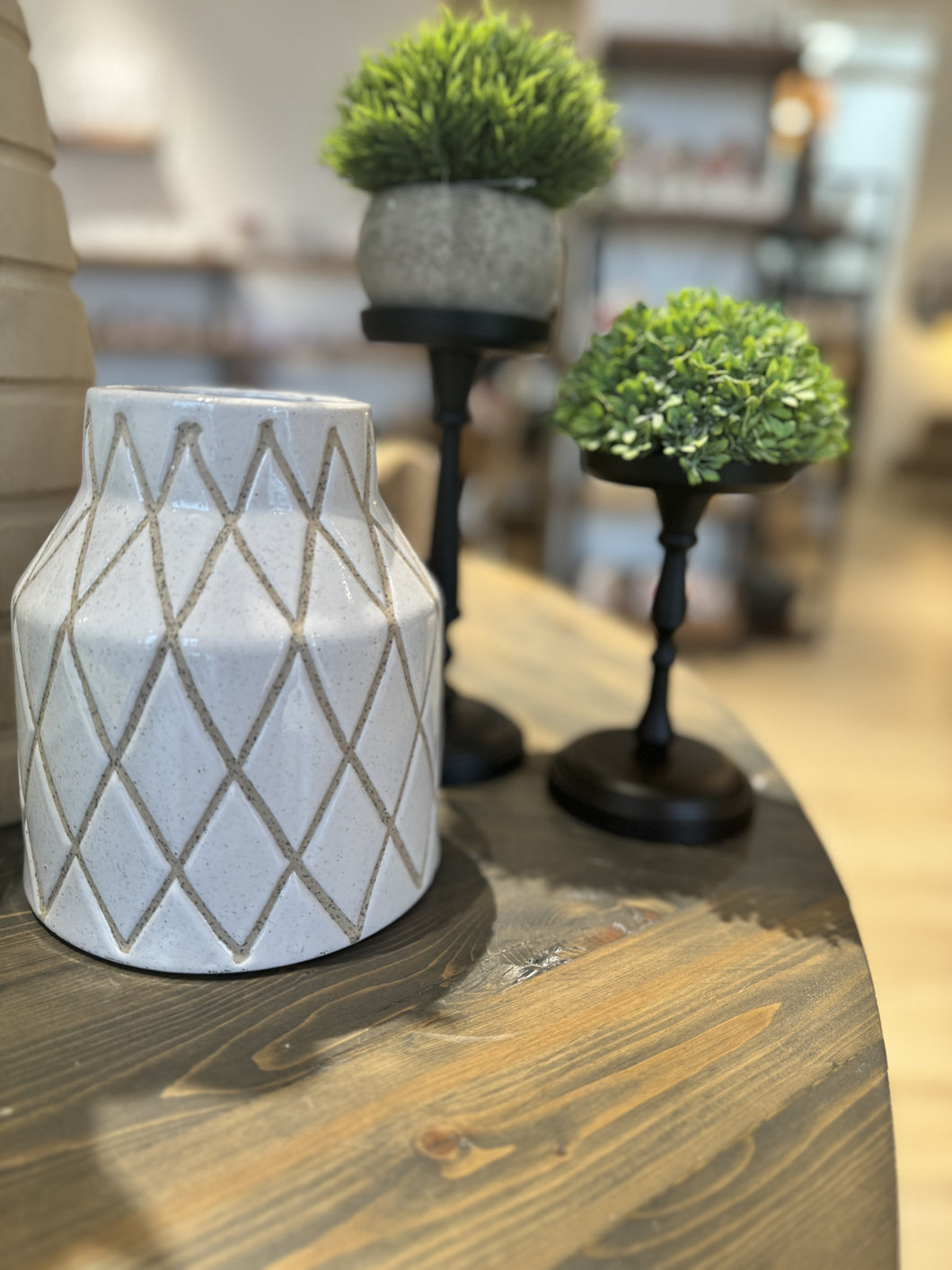 Speckled ceramic vase with a unique geodesic pattern. The vase has a modern and geometric design, with speckles of color throughout. It is perfect for displaying flowers or as a decorative accent. 