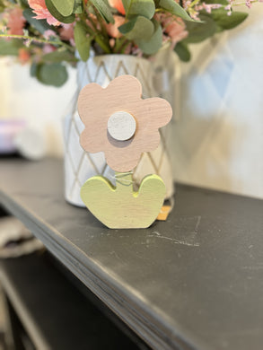 Small pink wooden poppy cutout with white center and green stem (3.25