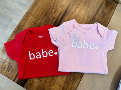 Adorable red/pink baby onesie with 