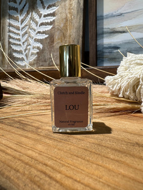 This fragrant roll on perfume in Lou has hints of orange blossom, vanilla, amber and rose. Inspired by Louis Vuitton.
