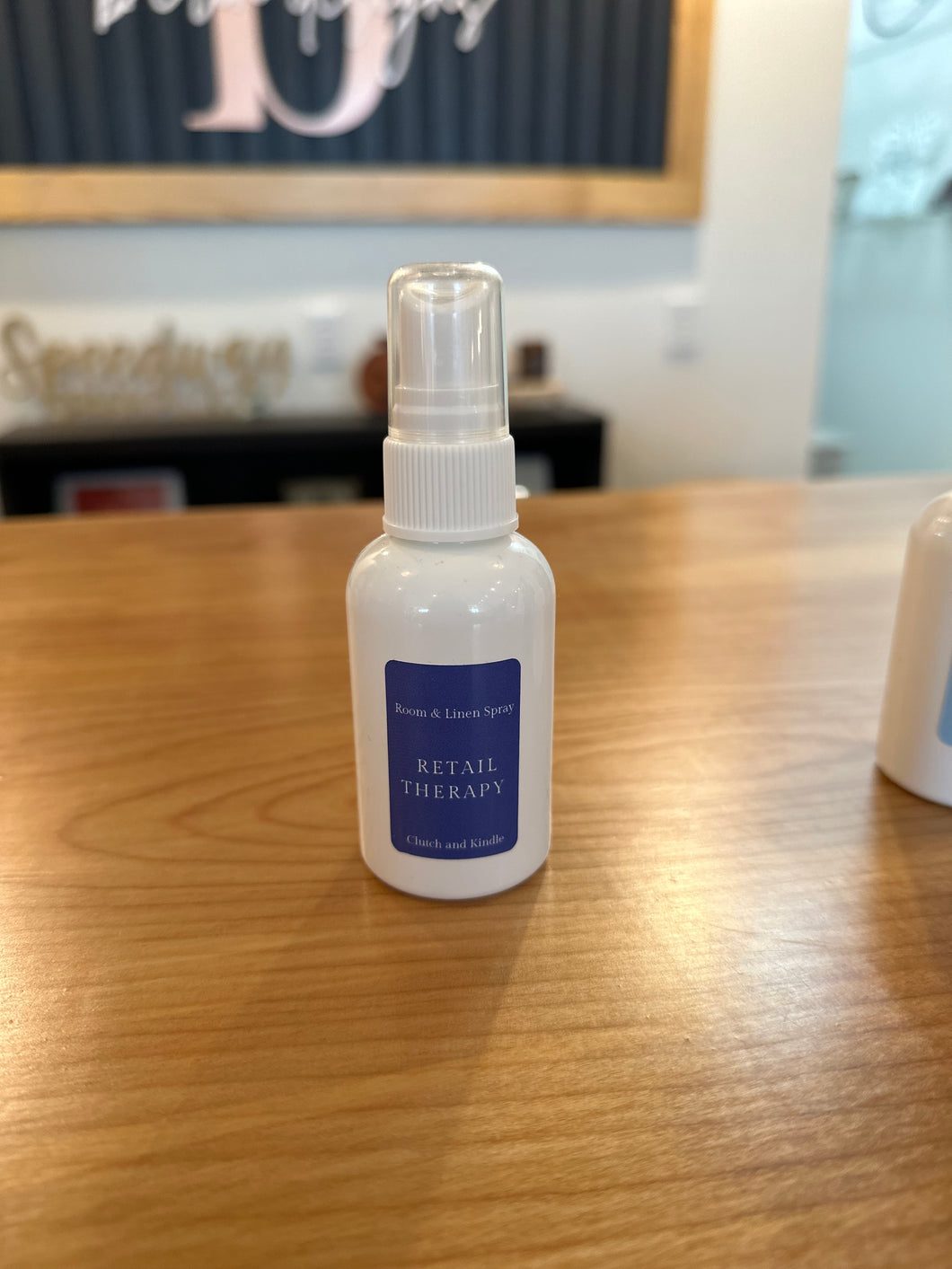 Room spray in RETAIL THERAPY - Inspired by the smell when you walk in Anthropolgie, with hints of sugar and citrus.