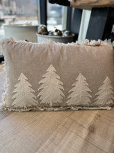 Load image into Gallery viewer, A cozy beige Christmas tree pillow with cream-colored Christmas trees on the front. The pillow is also adorned with lines of cream-colored fringe.
