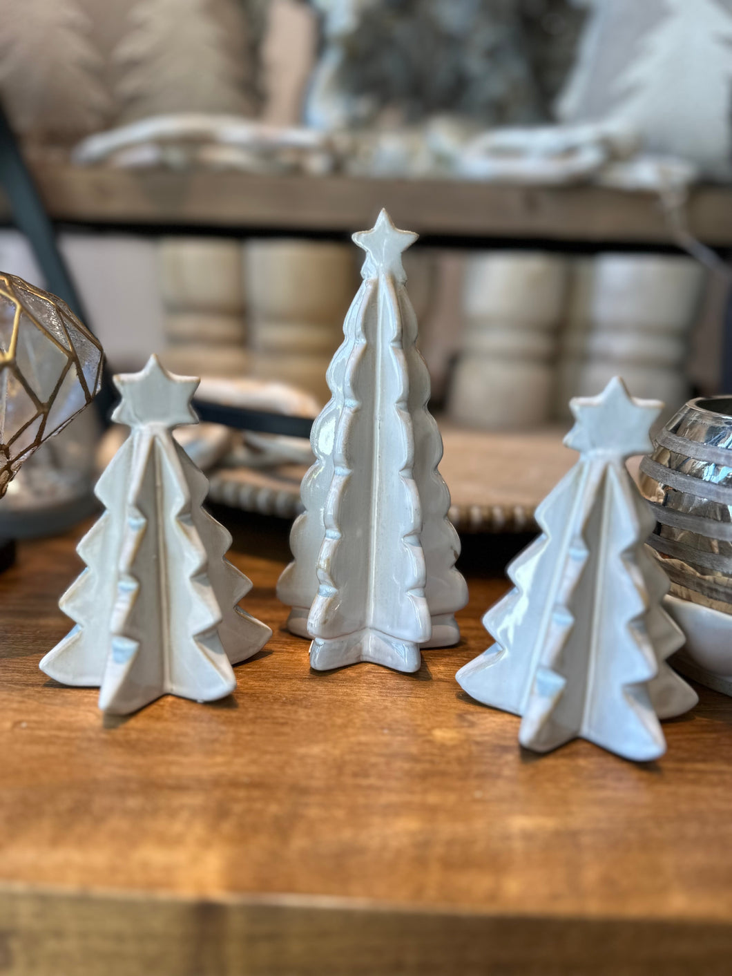 White mini ceramic Christmas tree with a star on top.  Comes in 5