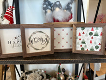 Load image into Gallery viewer, This mini holiday sign is perfect for adding a festive touch to your home décor. It comes in four styles: snowflake, Christmas trees, pine branch, and holly. The sign is made of wood. It is freestanding and can be placed on a shelf, mantel, or table.
