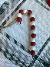 Load image into Gallery viewer, Wooden bead candy cane ornament with jute hanging. 
