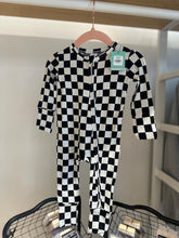 Load image into Gallery viewer, Checkered zipper onesie hanging from a hanger.  

