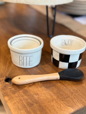 Mini bowl set of 2.  One bowl is white with the word BITE in think black lettering and the other bowl is black and white checkered with ENJOY etched in the inside.  Comes with wooden spoon with black silicone tip.  Perfect for nuts, raisins, olives, etc. 