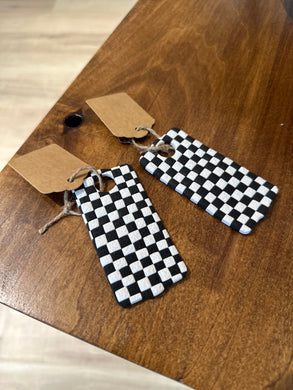 Black and white checkered clay tumbler tag.  