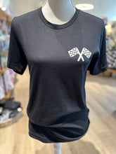 Load image into Gallery viewer, Front view of black tee.  2 crossing checkered flags on front left chest.  
