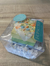 Load image into Gallery viewer, Sunshine Surprise sidewalk chalk resembles a piece of cake and has 3 layers of blue, green, and yellow calk with &quot;icing&quot; and &quot;sprinkles&quot;.  Comes packaged in a plastic clear container. 
