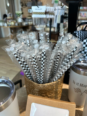 Checkered print straws in a basket. 
