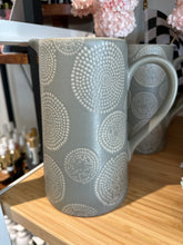Load image into Gallery viewer, Ceramic grey pitcher with cream circle patter all over.  
