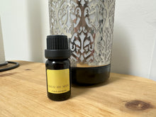 Load image into Gallery viewer, This home fragrance oil in COCO DE MER  contains floral, amber and coconut notes.
