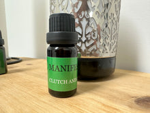 Load image into Gallery viewer, This home fragrance oil in MANIFEST has hints of bergamot, white tea and jasmine.
