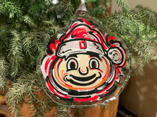 Load image into Gallery viewer, The Ohio State University Santa Hat Brutus Ornament by Justin Patten
