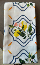 Load image into Gallery viewer, White tea towel with a lemon plant inside framed navy blue design.  Orange accents scattered on towel. 

