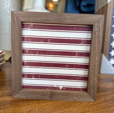 4x4 patriotic wooden sign with red and white stripes painted. 