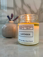 Load image into Gallery viewer, Lavender scented candle in a clear, 7.5 oz jar. 
