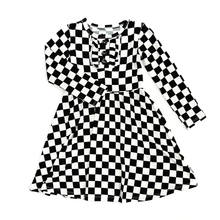 Load image into Gallery viewer, Black and white checkered dress with a white background. 
