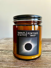 Load image into Gallery viewer, Soy candle celebrating the Eclipse.  Called Totality: Eclipse in Indy and made in a 7.5 oz far with black label of the eclipse.  
