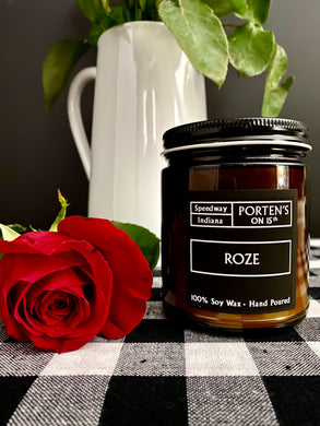 Roze candle next to a red rose. 7.5 oz jar. 