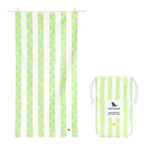 Load image into Gallery viewer, Kids quick dry towel that is light green and white striped.  Inside the green stripes are yellow suns and white and tan polka dots. Also pictured is the pouch the towel comes in, with the same pattern. 
