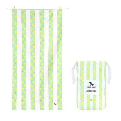 Kids quick dry towel that is light green and white striped.  Inside the green stripes are yellow suns and white and tan polka dots. Also pictured is the pouch the towel comes in, with the same pattern. 