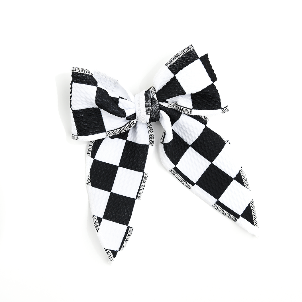 Black and white checkered hair bow with alligator clip in back. 