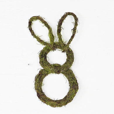 Mossy Twig Rabbit Wreath features 2 cut out circles made of twigs covered with moss with 2 bunny ear cutouts made of the same material.  