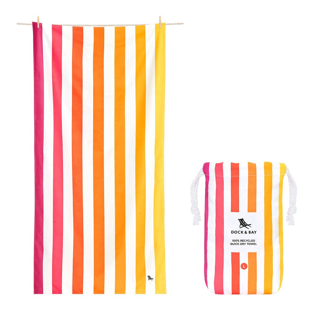 Dock & Bay Quick Dry Towel in the color Peach Sunrise.  This towel is striped white and various shades of yellow, orange, and pink.  Also shown is the pouch it comes in, which is also the same design as the towel. 