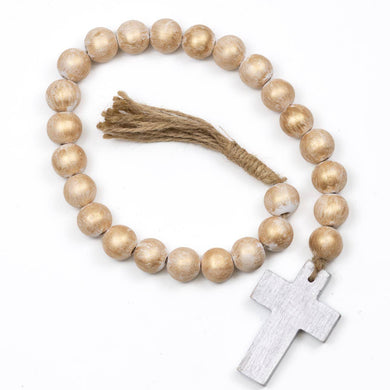 St. Michael Prayer Beads, the beads are gold with a twine tassel at the end and the other end is a silver painted cross. 