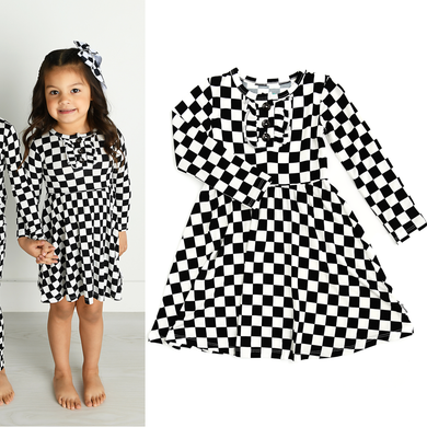 Checkered tutu dress alone and on a little girl.  Long sleeve with ruffle around 3 buttons on top.  