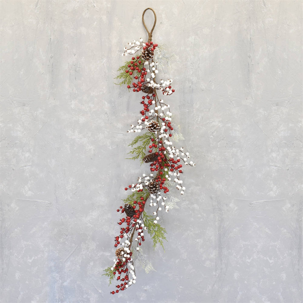 Cedar pinecone garland with red and white berries and snow touched pinecones.  54