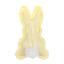 Load image into Gallery viewer, Small yellow stuffed animal resembling a bunny, made with a textured fabric resembling waffles. It has a white fluffy ball attached to its back.
