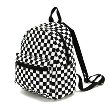 Load image into Gallery viewer, Black and white checkered mini backpack with adjustable straps. 
